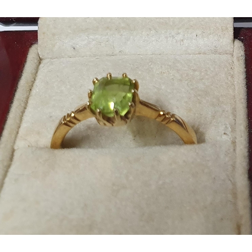 28 - 18ct stamped ring with solitaire green, Peridot type stone,

3.2 grams gross       size P