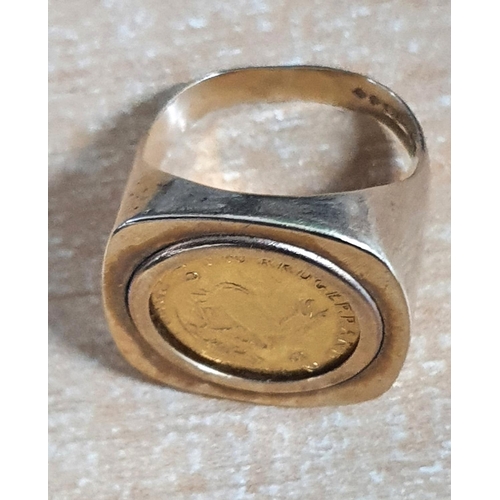 54 - Hallmarked 9ct yellow gold coin ring holding a 1/10th Krugerand,

10.8 grams        size P