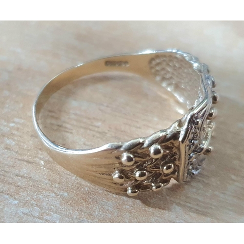 95 - Gents hallmarked 9ct yellow gold best buckle ring with a couple of illusion set diamonds in platinum... 