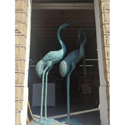 375 - Pair of huge bronze Herons, largest one is approx. 8ft. tall and the other approx. 7.5ft. tall (2)