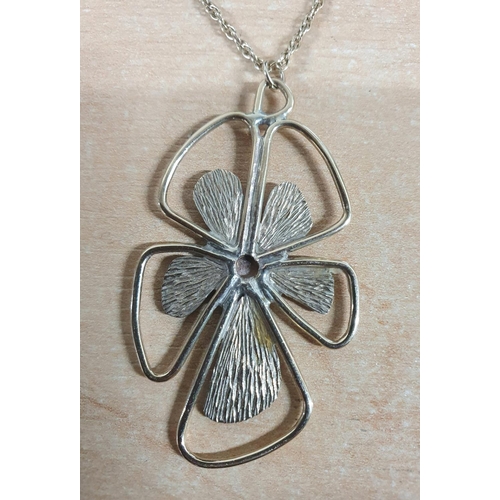 75 - Large flower petal pendant stamped 9ct on rope chain,

10.2 grams         56cm long