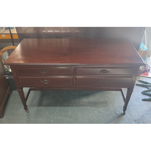 674 - Goodall Lamb and Heighway, Manchester, four-drawer desk situated on castors