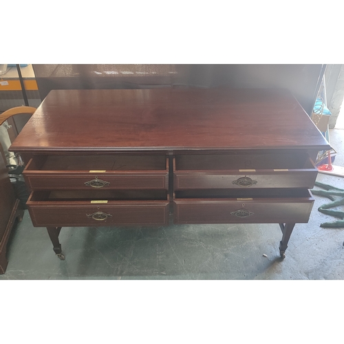 674 - Goodall Lamb and Heighway, Manchester, four-drawer desk situated on castors