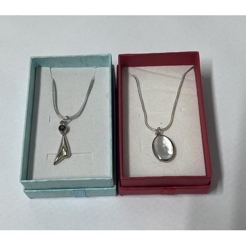 32 - 925 silver MOP pendant along with silver/red stone upturned heart and another silver MOP vertical ba... 