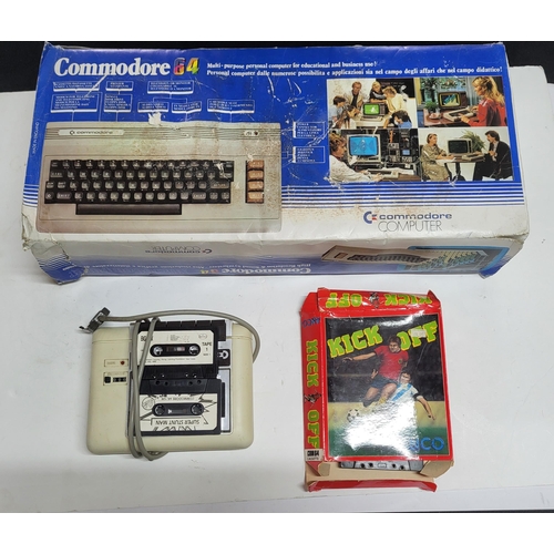156 - original Boxed Commodore 64 computer along with a cassette player and a collection of Cassettes and ... 