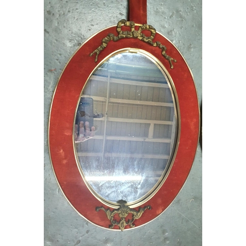 221 - French style oval wall mirror together with a small circular mirror in beaten brass frame (2)