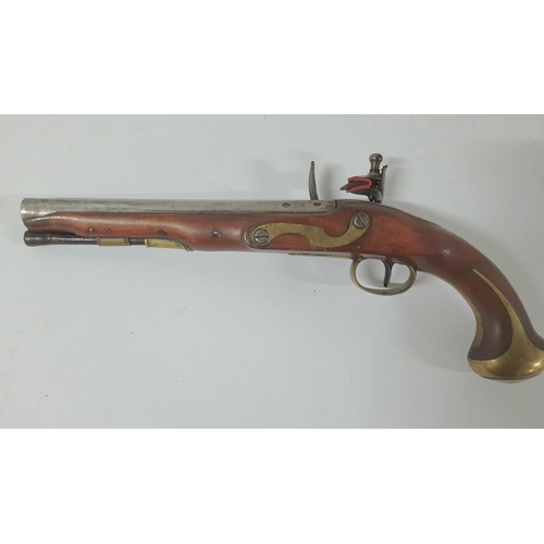 33 - A Georgian flintlock pistol by Henry Nock of London, 21cm barrel, brass trigger guard & ramrod with ... 