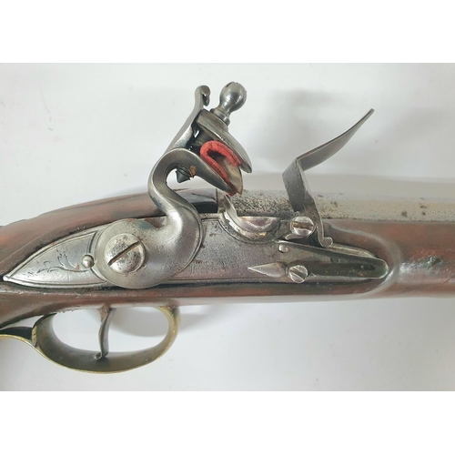 34 - A Georgian flintlock pistol, 18.5cm barrel, brass trigger guard & ramrod with good working action th... 