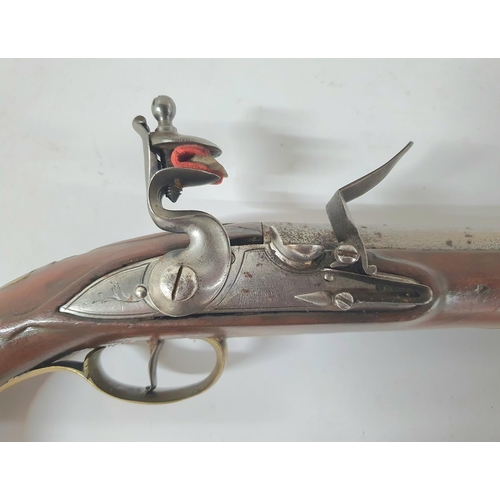 34 - A Georgian flintlock pistol, 18.5cm barrel, brass trigger guard & ramrod with good working action th... 