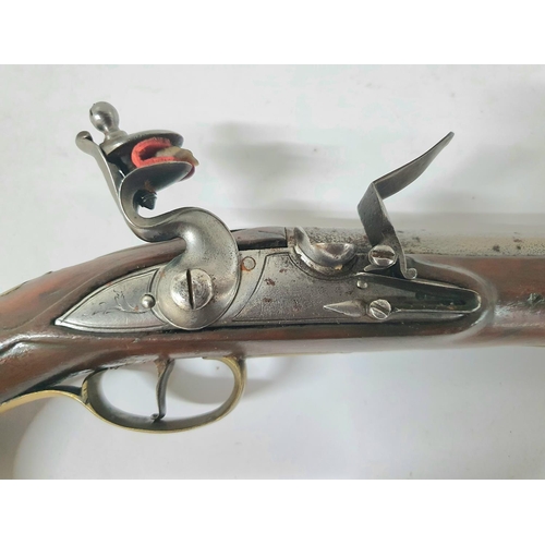 34 - A Georgian flintlock pistol, 18.5cm barrel, brass trigger guard & ramrod with good working action th... 