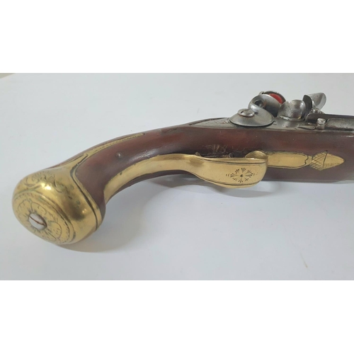 34 - A Georgian flintlock pistol, 18.5cm barrel, brass trigger guard & ramrod with good working action th... 