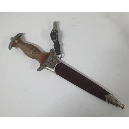 47 - NSKK dagger with cross-hatched carved wooden grip, the double-edged blade etched 