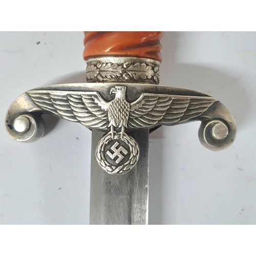 51 - German Army Officers parade dagger. The dagger having a steel oak leaf pommel, twisted celluloid gri... 