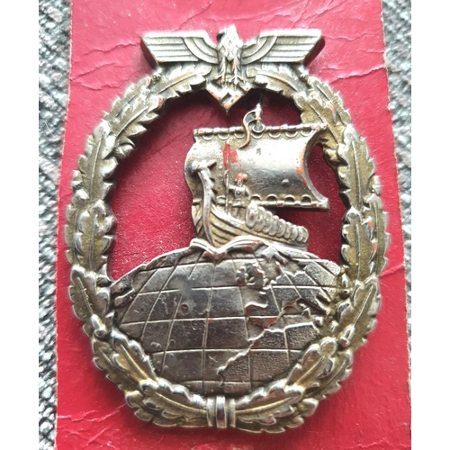 20 - Rare WWII German Kriegsmarine, Auxiliary Cruiser cap badge with makers mark R.R.S. stamped verso (to... 