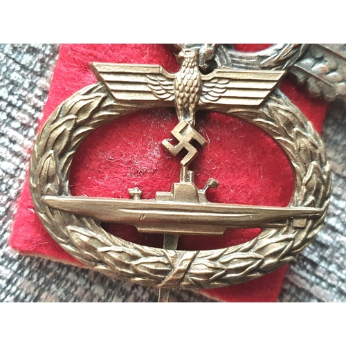 21 - Three WWII German cap badges to include a rare Kriegsmarine U-boat clasp in bronze 1st pattern by Sc... 