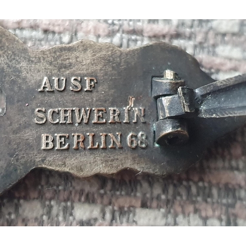 21 - Three WWII German cap badges to include a rare Kriegsmarine U-boat clasp in bronze 1st pattern by Sc... 