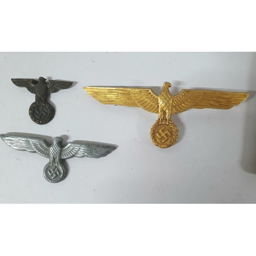 8 - Two German WWII spread Eagle cap badges together with a WW2 German Kriegsmarine gilt metal tunic che... 