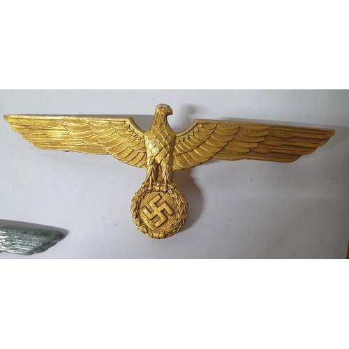 8 - Two German WWII spread Eagle cap badges together with a WW2 German Kriegsmarine gilt metal tunic che... 