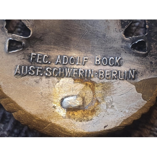 16 - RARE unidentified WWII German cap badge of a bird at rest with a laurel wreath, stamped WSB for the ... 