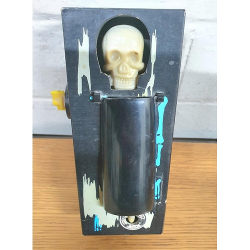 78 - Vintage plastic Coffin Bank