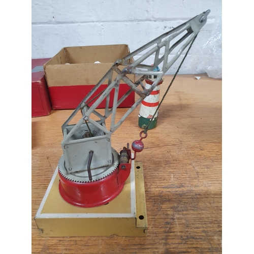 84 - Vintage Hornby (by Meccano) tin plate crane with original box, tin plate ramp and light house (3)