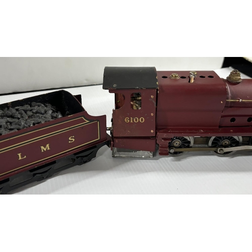 90 - Steam train engine with 6100 on the side looks like the engine has been put in after but is very hea... 