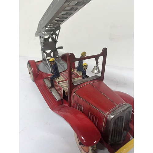 153 - Vintage tin fire engine possibly Wells,

36cm long