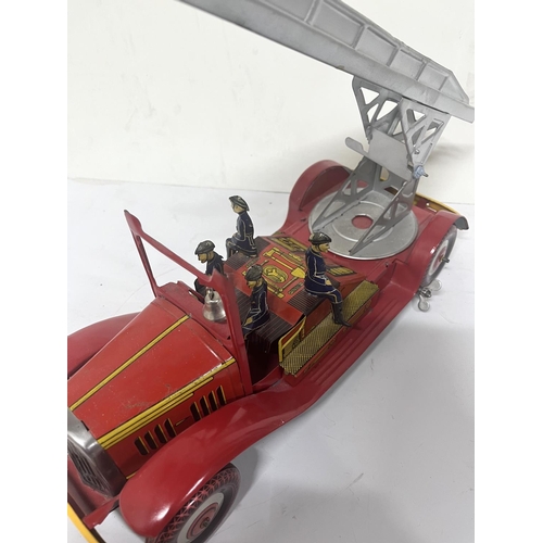 155 - Mettoy vintage tin plate fire engine,

36cm long