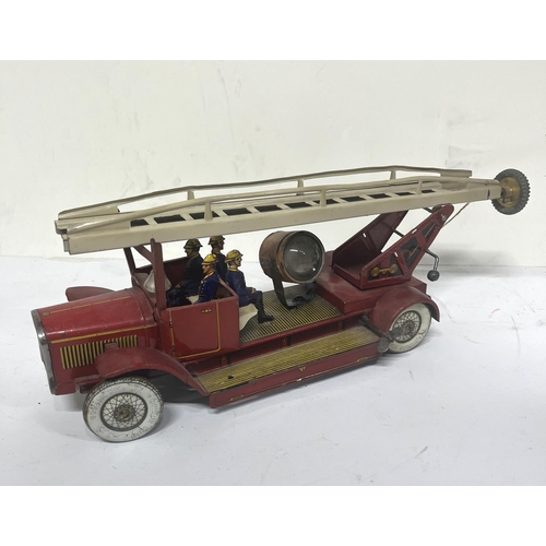 156 - Vintage tin plate clockwork  fire engine with searchlight. 

Unknown maker 

40cm long