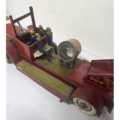 156 - Vintage tin plate clockwork  fire engine with searchlight. 

Unknown maker 

40cm long