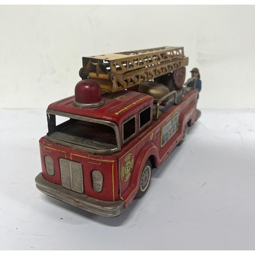 157 - Shokai Japan tin plate Fire Engine,

33cm long