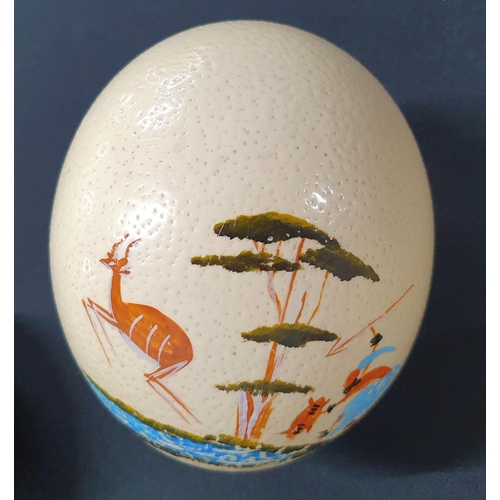 236 - Three hand-painted tourist Ostrich eggs and another (4)