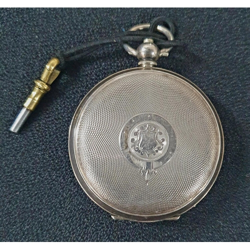 214 - Late Victorian silver pocket watch with engraved back plate with central shield motif and with key