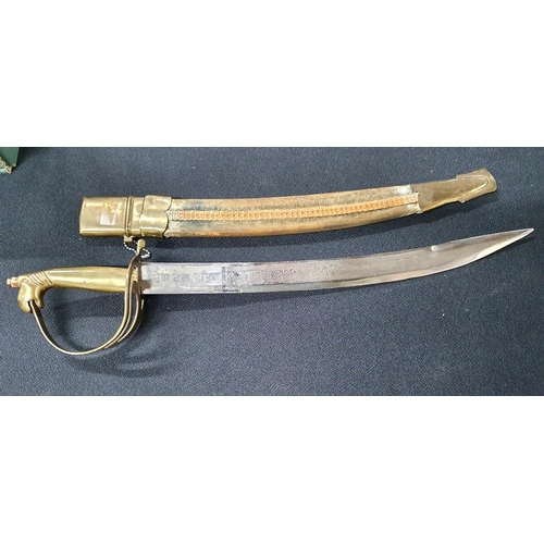 355 - Indian 20thC short sword with engraved blade, brass handle with horses head and scabbard