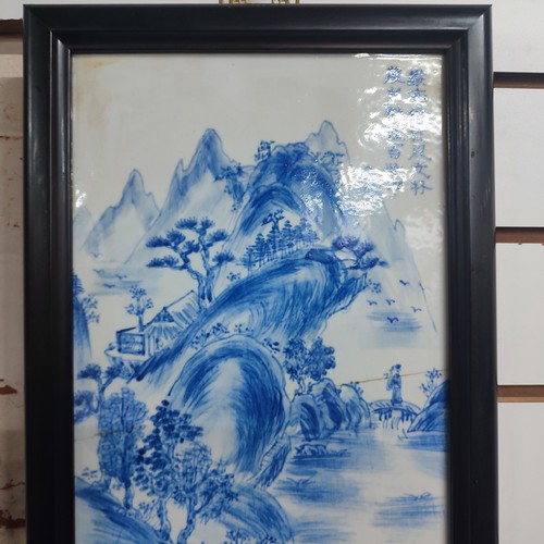 364 - Framed Chinese hand painted porcelain panel depicting a village scene, 

measures 22cm x 75cm