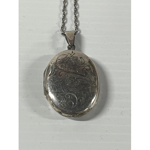 1 - Silver locket pendant on a chain,

11.7 grams