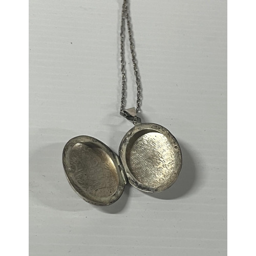 1 - Silver locket pendant on a chain,

11.7 grams