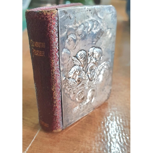 11 - Birmingham 1905 silver fronted miniature book of prayer, the silver front decorated with head of Ang... 