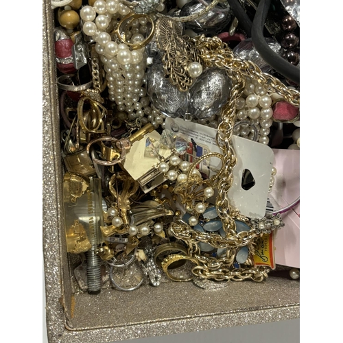 21 - Large box full of costume jewellery including rings and badges  (Qty)