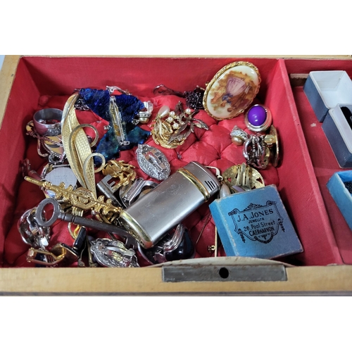 24 - Jewellry box containing a collection of various costume jewelry (Qty)