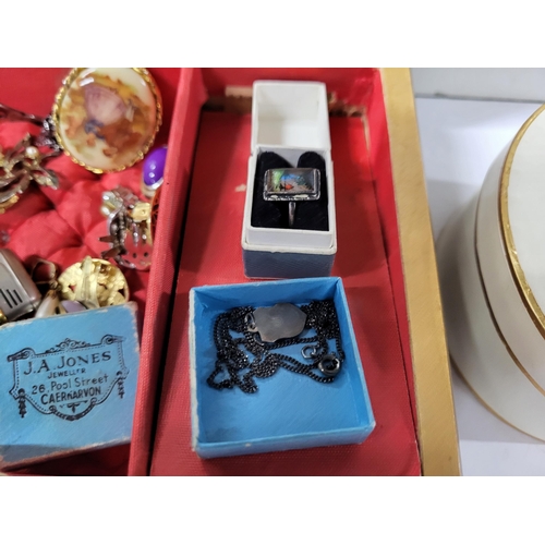 24 - Jewellry box containing a collection of various costume jewelry (Qty)