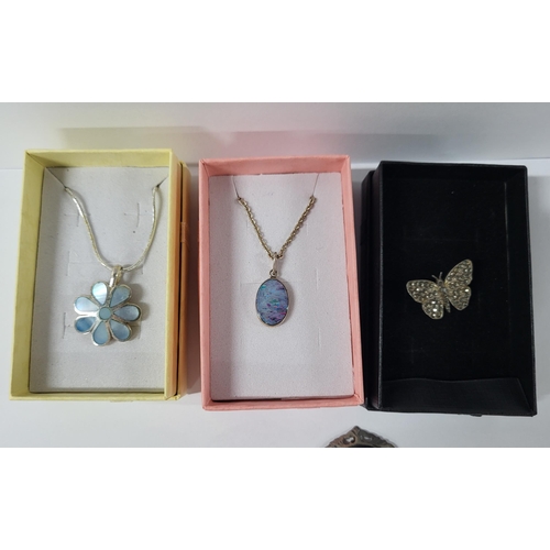 25 - two silver necklaces, and three various silver brooches including a butterfly (5)