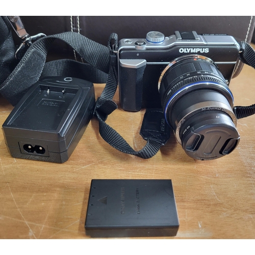 193 - Olympus Digital camera with charger and case