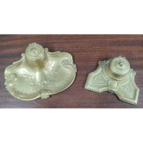 239 - Two ornate brass inkwells, both with their ceramic liners (2)