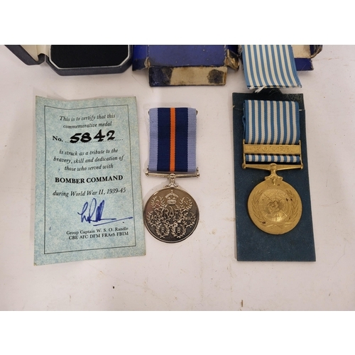 267 - Pair of medals one is a Bomber command commemorative medal and a UN Korean medal (2)