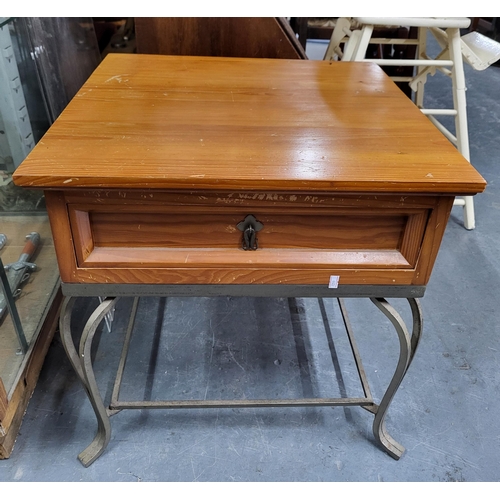 642 - Wooden side table with a drawer and ornate metal legs