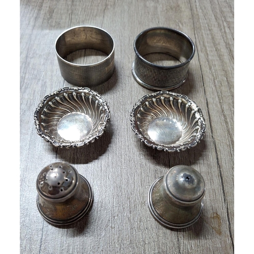 12 - Mixed lot of English silver to consist of 2 napkin rings, a pair of small salts and a pair of salts,... 