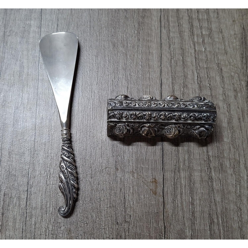 14 - Unmarked white metal ornate toothpick box (possibly Dutch) together with a silver handled shoe horn ... 