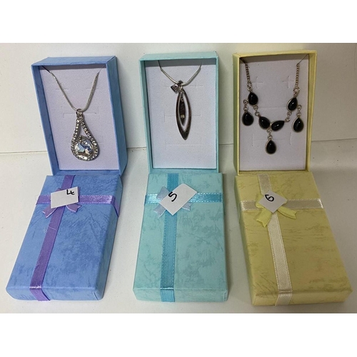 25 - Three 925 silver chains with varying pendants including a large crystal teardrop pendant and a doubl... 