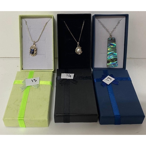 29 - Three 925 silver chains with varying pendants including a Blue enamel scarab pendant (3)